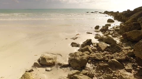 Scenic Low Angle Barbary Beach Rocks and Shoreline, Bahamas Stock Footage 100510190