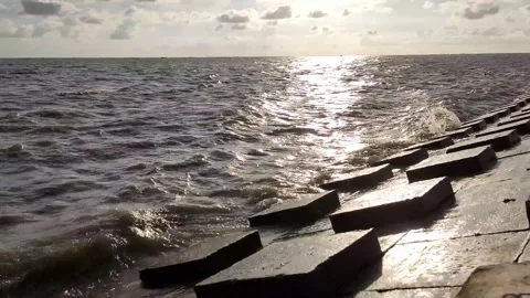 Scenic Meghna River Waves with Sun Reflection and Cloudy Sky in Bangladesh Stock Footage 343196915