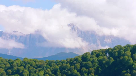 Scenic mountain landscape with clouds covering peaks Stock Footage 337010565