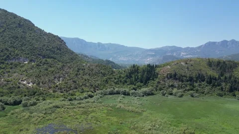 Scenic Mountain Landscape Featuring Lush Greenery and Majestic Natural Beauty Stock Footage 295154667