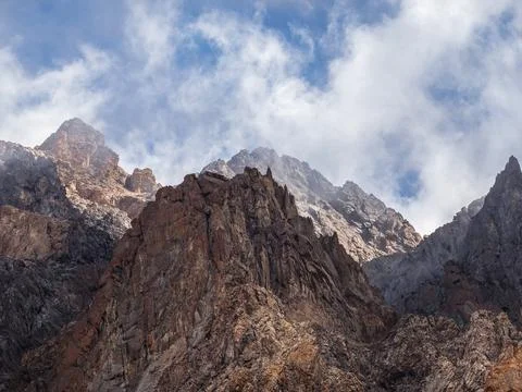 Scenic mountain landscape with sharp rocks under blue cloudy sky. Colorful .. Stock Photos