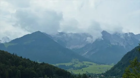 Scenic Mountain Landscape Under Dramatic Cloudy Sky Stock Footage 323298202