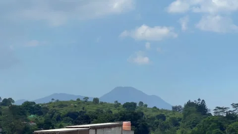 Scenic mountain landscape view under blue sky with clouds 動画素材 340485785