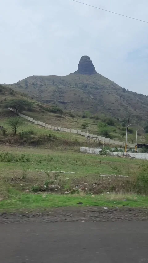 Scenic Mountain Landscape Viewed from Moving Car on Rural Road 動画素材 339778958