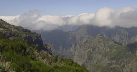 Scenic mountain peaks in the clouds, 4K Stock Footage 246352353