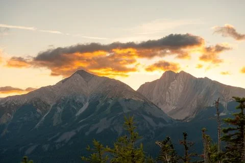 Scenic mountain range against sunset sky, beautiful mountain landscape views. Stock Photos