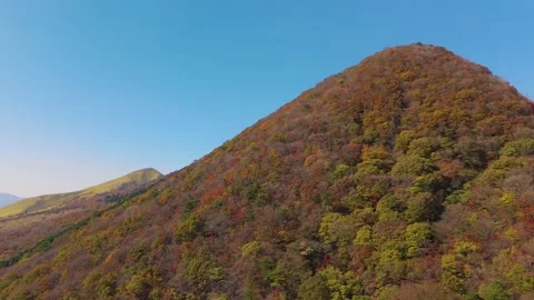 Scenic Mountain Range in Early Autumn Colors – 4K Drone View Stock Footage 336974983