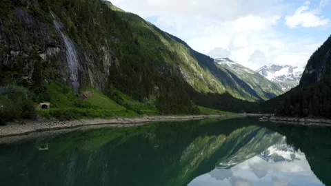 Scenic mountain reflection over calm lake in summer 動画素材 320338566