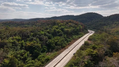Scenic Mountain Road Surrounded by Forest Stock Footage 327506551