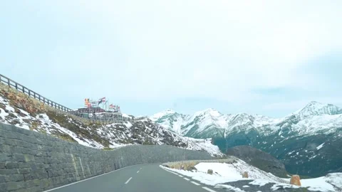Scenic mountain road winds through the snowy landscape of the Grossglockner in Stockbeeldmateriaal 282758017