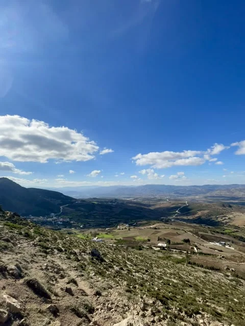 Scenic mountain summit view overlooking rolling hills and natural landscapes Stock Footage 325767778