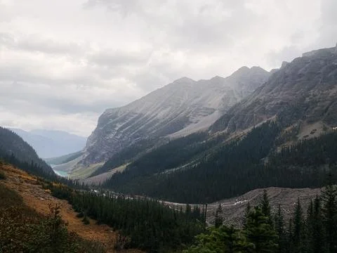 Scenic mountain valley under cloudy sky in the Canadian Rockies. Stock Photos