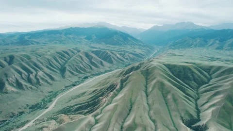 Scenic mountain view and bare hills, alpine landscape aerial shot Stock Footage 213647630