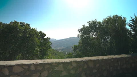 Scenic Mountain View Framed by Stone Wall and Trees in Kurdistan Stock Footage 316233091