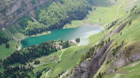 Scenic mountain view over a tranquil lake surrounded by greenery Stock Footage 320304534