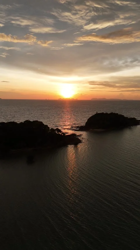 Scenic Ocean Sunset Reflecting Over Tropical Islands in Koh Lanta, Thailand Stock Footage 335960330
