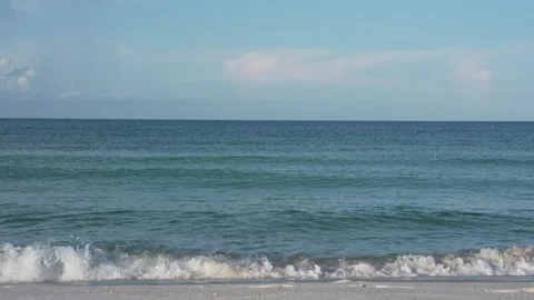 Scenic ocean view with gentle waves and sandy shore in Florida, sunny day Stock Footage 345689643
