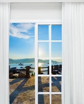 Scenic Ocean View from Open Window at Sunset.. Foto stock