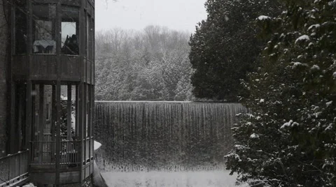 Scenic Old Mill Waterfall Light Winter Falling Snow and River in the Country Stock Footage 48879005