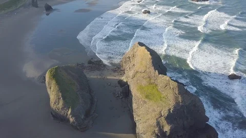 Scenic panoramic aerial drone view of flight above ocean and beach with rocks. Stock Footage 129349947