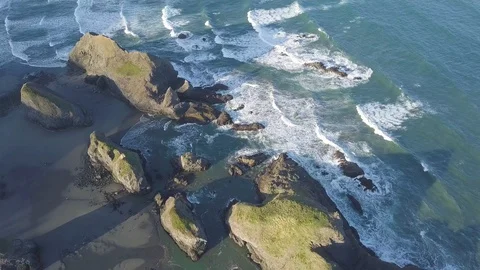 Scenic panoramic aerial drone view of flight above ocean and beach with rocks. Stock Footage 129350144