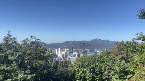 Scenic panoramic landscape of Seoul viewed from Namsan Mountain near N Seoul Tow Stock Footage 346957434