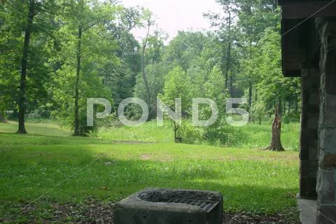 Scenic Park With Old Grill Near Shelter Stock Photos