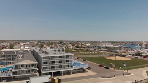SCENIC REVEAL OF BEACH TOWN, PULL BACK Stock Footage 93552533
