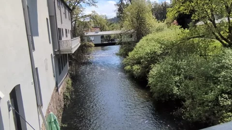 Scenic river flowing beneath a historic covered bridge in Silverton, Oregon Stock-Footage 337136936
