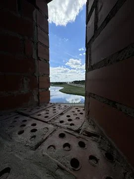 Scenic River View Framed by Brickwork Stock Photos