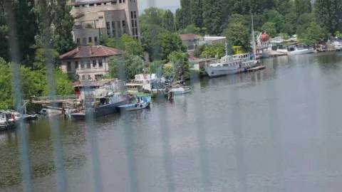 Scenic river view from moving train traveling through Varna, bulgaria Stock Footage 339849970
