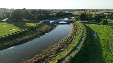 Scenic River with Walking Path and Bridge Video stock 290822058