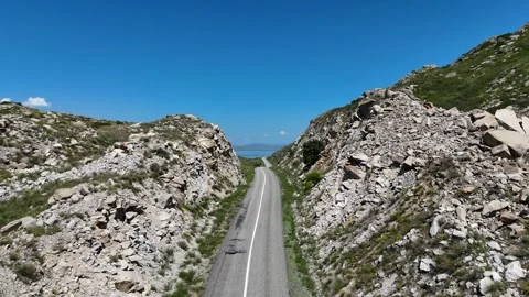 Scenic Road Between White Cliffs with Lake View from Drone Stock Footage 317510811