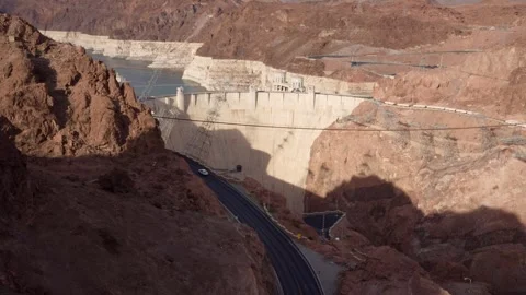 Scenic road winding between towering orange rock formations near Hoover Dam Stock Footage 342061226