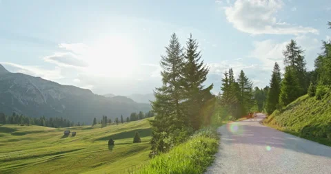 Scenic road winding through dolomites mountains in italy Stock Footage 340794074