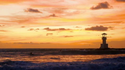 Scenic seascape at sunset time, waves, silhouette of surfer on surfboard Stock Footage 212683473