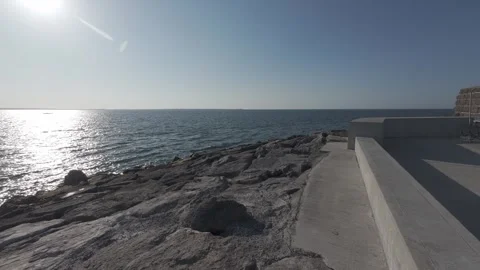 Scenic seaside walkway path under bright sunny blue sky in ireland Stock Footage 340459441