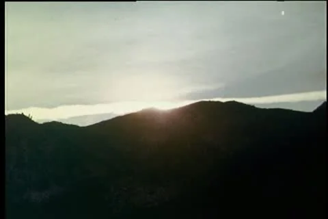 Scenic shot of sun setting over mountain range 動画素材 25207016