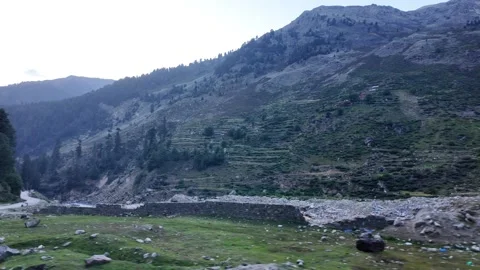 A Scenic Side View from a Car on a Concrete Road, Moving Alongside a Flowing Stock Footage 289190837