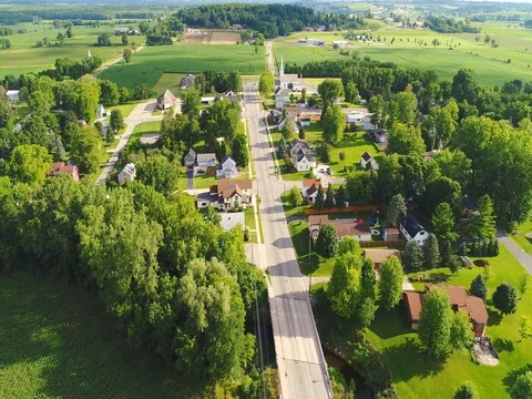Scenic small town nestled amid fertile valley in beautiful rural Wisconsin Stock Footage