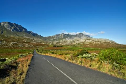 Scenic South Africa. A country road meandering through a picturesque landscape. Stock Photos