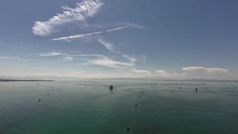 Scenic summer view of Lake Constance with distant mountains and calm water Stock Footage 339340543