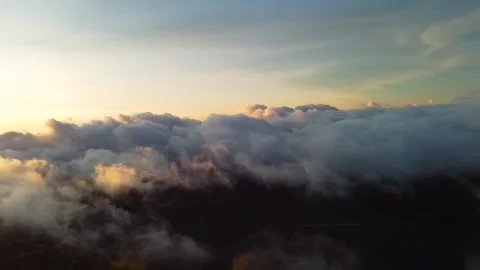 Scenic sunrise above clouds over bromo volcano in indonesia Video stock 336648044