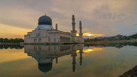 Scenic sunrise of Mosque with full reflection in the water pan left to right Stock Footage 83235646