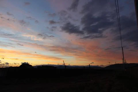 Scenic Sunset Dramatic Sky with Fluffy Orange Pink Clouds Stock Photos