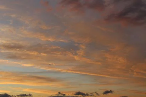 Scenic Sunset Dramatic Sky with Fluffy Orange Pink Clouds Stock Photos