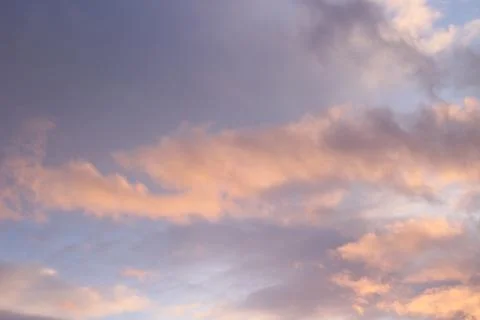 Scenic Sunset Dramatic Sky with Fluffy Orange Pink Clouds Stock Photos