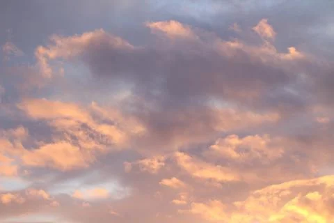 Scenic Sunset Dramatic Sky with Fluffy Orange Pink Clouds Stock Photos