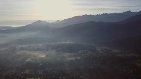 Scenic sunset drone flight above mountain range silhouette aerial view. The f Stock Footage 164035742