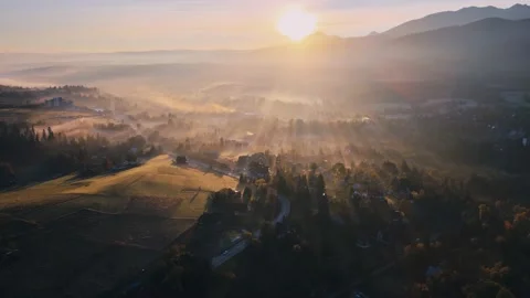 Scenic sunset drone flight above mountain range silhouette aerial view. The f Stock Footage 164035778